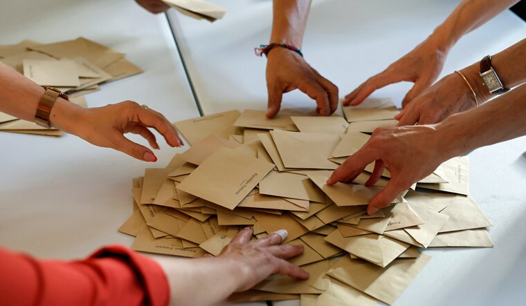 Volunteers count ballots in a polling station Sunday, June 19, 2022 in Bischeim, outside Strasbourg, eastern France | AP