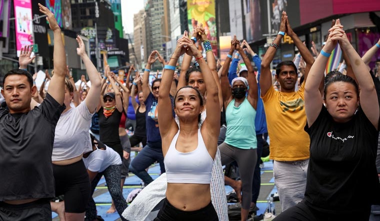 People participate in a Yoga session in New York City | Reuters
