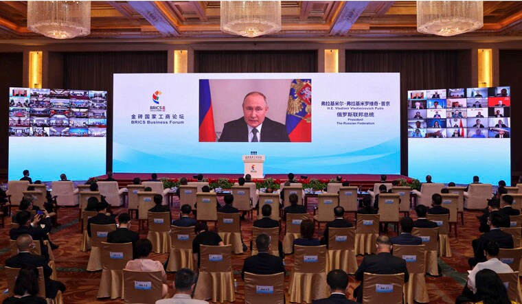 In this photo released by Xinhua News Agency, Russian President Vladimir Putin delivers a keynote speech in virtual format at the opening ceremony of the BRICS Business Forum in Beijing Wednesday, June 22, 2022. The conflict in Ukraine has "sounded an alarm for humanity," Chinese leader Xi Jinping said Wednesday, as China continues to assume a position of neutrality while backing its ally Russia. (Yin Gang/Xinhua via AP)