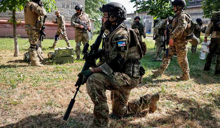 Members of a foreign volunteers unit which fights in the Ukrainian army take positions, as Russia's attack on Ukraine continues, in Sievierodonetsk, Luhansk region Ukraine June 2, 2022 | Reuters