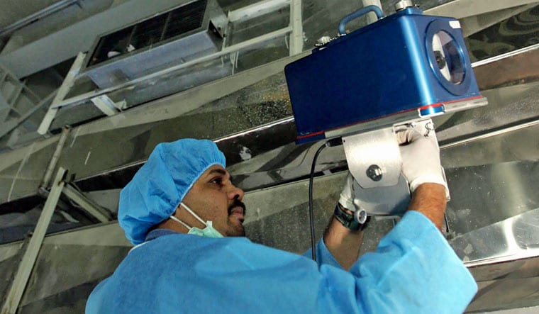 An inspector of the International Atomic Energy Agency sets up surveillance equipment, at the Uranium Conversion Facility of Iran, just outside the city of Isfahan, Iran, Aug. 8, 2005. Iran turned off two surveillance cameras of the United Nations' nuclear watchdog that monitored one of its atomic sites, state television reported Wednesday, June 8, 2022 | AP