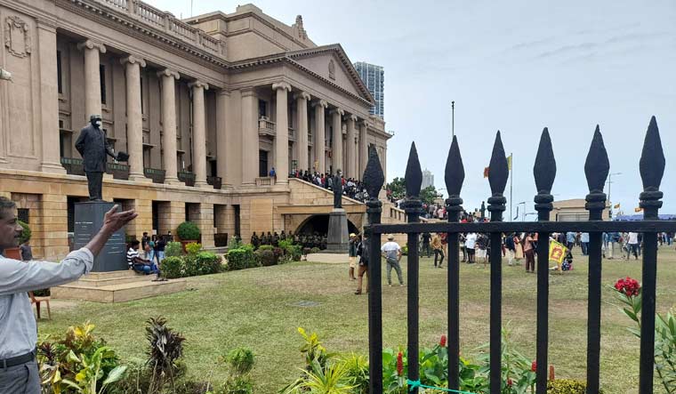 A broken iron fence of the presidential secretariat in Colombo | AFP