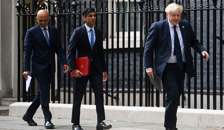 [File] From left, British Health Secretary Sajid Javid, Chancellor of the Exchequer Rishi Sunak and Prime Minister Boris Johnson  | AP