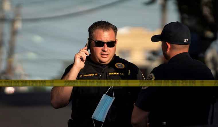 New Jersey Police officers stand guard near the building where alleged attacker of Salman Rushdie, Hadi Matar, lives in Fairview | Reuters