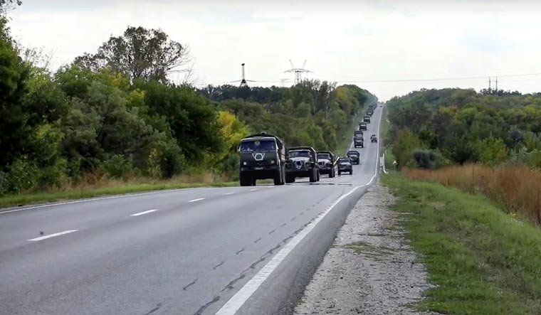  Russian military vehicles drive to the Kharkiv direction | Russian Defense Ministry Press Service / AP