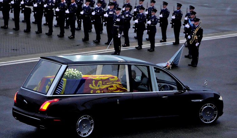 The coffin of Queen Elizabeth II carried in a hearse is leaving RAF Northolt in London, to be taken to Buckingham Palace, Tuesday, Sept. 13, 2022 | Reuters