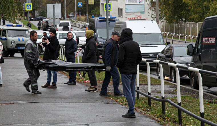 Funeral workers carry a body of victim at the scene of a shooting at school No. 88 in Izhevsk, Russia, Monday, Sept. 26, 2022. Authorities say a gunman has killed 15 people and wounded 24 others in a school in central Russia. According to officials, 11 children were among those killed in the Monday morning shooting in School No. 88 in Izhevsk, a city 960 kilometers (600 miles) east of Moscow in the Udmurtia region. (AP Photo)