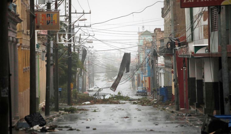 Debris hang on the street in the aftermath of Hurricane Ian's passage through Pinar del Rio, Cuba, September 27, 2022 | Reuters
