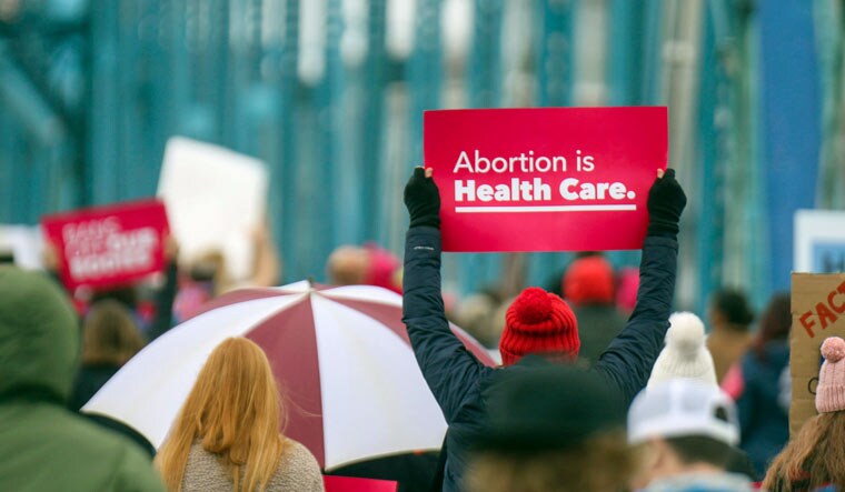 A march makes its way across the Walnut Street Bridge in Chattanooga, Tenn., Sunday, Jan. 22, 2023, to commemorate the 50th anniversary of the Roe v Wade decision | AP