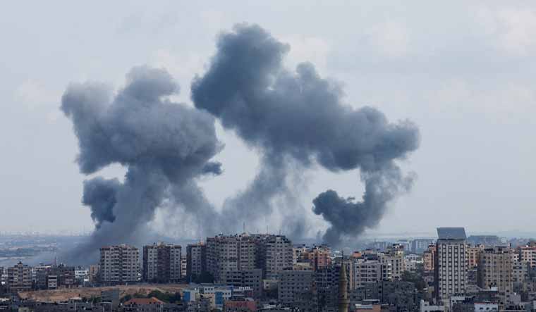 Smoke emanating from the ruins of a building following an air raid by Israeli forces | Reuters