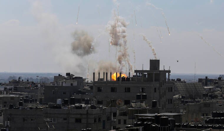 Smoke and fire rise from an explosion after an Israeli airstrike in Rafah, Gaza Strip, Friday, Oct. 13, 2023. (AP Photo/Hatem Ali)