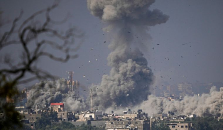 Smoke rises following an Israeli airstrike in the Gaza Strip, as seen from southern Israel | AP