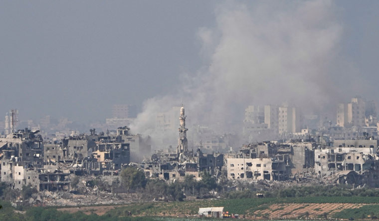 Smoke rises following an Israeli airstrike in the Gaza Strip, as seen from southern Israel | AP