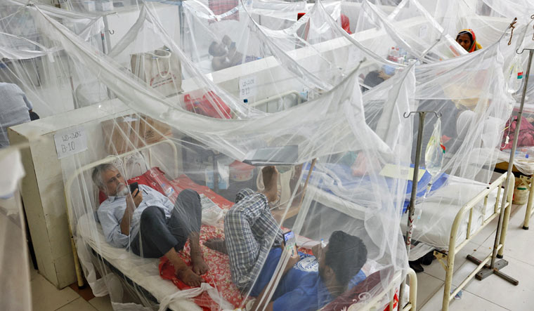 Dengue-infected patients stay under mosquito nets as they receive treatment at the Shaheed Suhrawardy Medical College and Hospital in Dhaka, Bangladesh, July 26, 2023 | Reuters