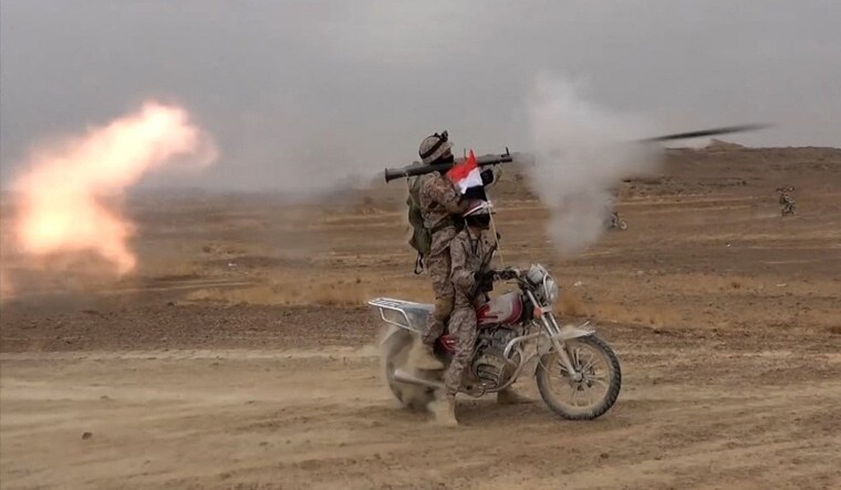 Houthi-fighter-fires-grenade-reuters