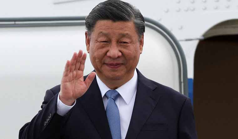 Chinese President Xi Jinping waves as he arrives at San Francisco International Airport to attend the APEC Summit in San Francisco, California | Reuters