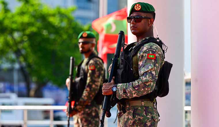 Maldives' Army soldiers stand guard ahead of the inaguration of Maldives' president-elect Mohamed Muizzu ahead of the inauguration ceremony in Male | AFP
