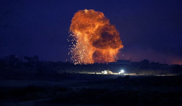 An explosion takes place during Israeli air strikes over Gaza, as seen from southern Israel, amid the ongoing conflict between Israel and Hamas on November 22, 2023 | Reuters