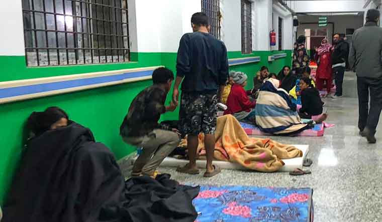 Survivors are seen at a corridor of the Jajarkot district hospital in the aftermath of an earthquake in Jajarkot | AFP