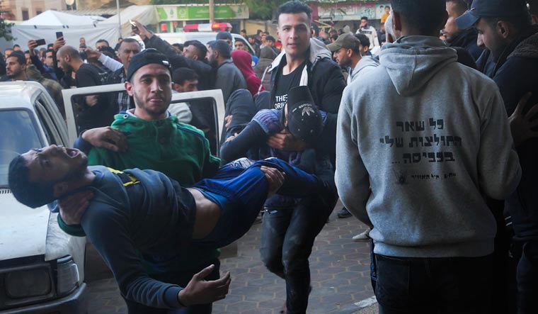 Palestinians wounded in the Israeli bombardment of the Gaza Strip are brought to the hospital in Deir al Balah, Gaza Strip | AP