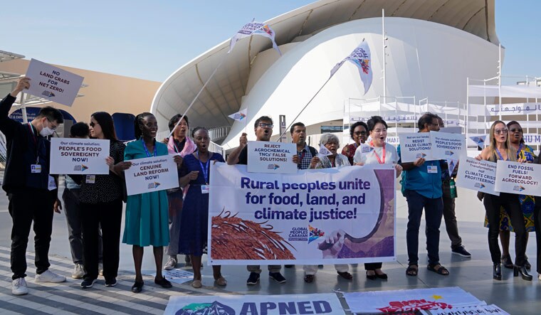Activists demonstrate at the COP28 U.N. Climate Summit, Wednesday, Dec. 6, 2023, in Dubai, United Arab Emirates | AP