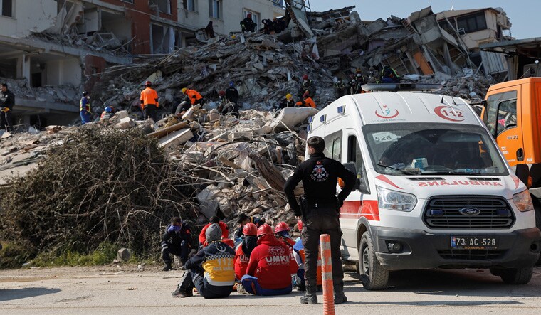 Rescuers work at the site of a collapsed building, in the aftermath of the deadly earthquake, in Antakya, Turkey February 18, 2023. REUTERS/Maxim Shemetov