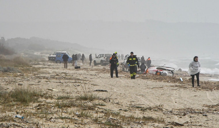 Rescuers arrive at the scene after a migrant boat broke apart in rough seas, at a beach near Cutro, southern Italy, Sunday, Feb. 26, 2023. Rescue officials say an undetermined number of migrants have died and dozens have been rescued after their boat broke apart off southern Italy. (AP Photo/Giuseppe Pipita)