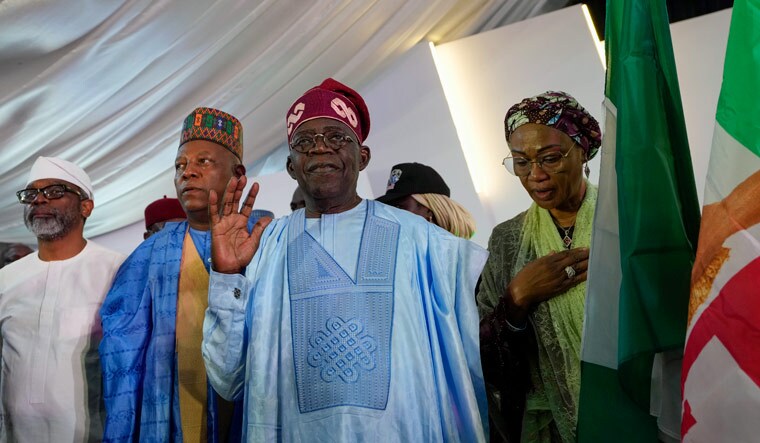 Bola Tinubu of the All Progressives Congress, center, accompanied by his wife Oluremi Tinubu, right, leaves the party's campaign headquarters after winning the presidential elections in Abuja, Nigeria, Wednesday, March 1, 2023 | AP
