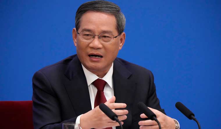 Chinese Premier Li Qiang speaks during a press conference held after the closing ceremony for China's National People's Congress at the Great Hall of the People in Beijing | AP