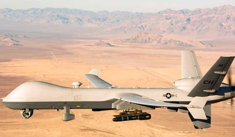 A handout photo released by the US Air Force showing an MQ-9 Reaper unmanned aerial vehicle (UAV or drone) flying over the Nevada Test and Training Range | AFP