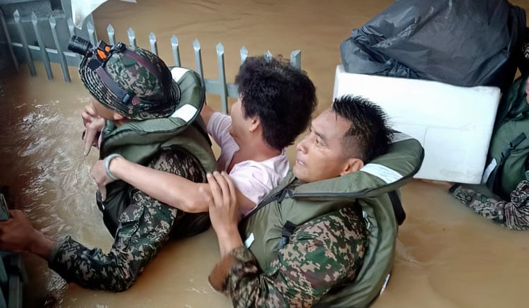 In this photo released by National Disaster Management Agency, the army evacuate residents on Chaah town in Segamat, in southern Johor state, Malaysia, Wednesday, March 1, 2023 | AP