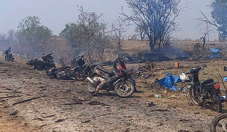 This photo provided by the Kyunhla Activists Group shows aftermath of an airstrike in Pazigyi village in Sagaing Region's Kanbalu Township, Myanmar, Tuesday, April 11, 2023. Witnesses and independent media reports said dozens of villagers in central Myanmar have been killed in an air attack carried out Tuesday by the Southeast Asian country's military government. (Kyunhla Activists Group via AP)