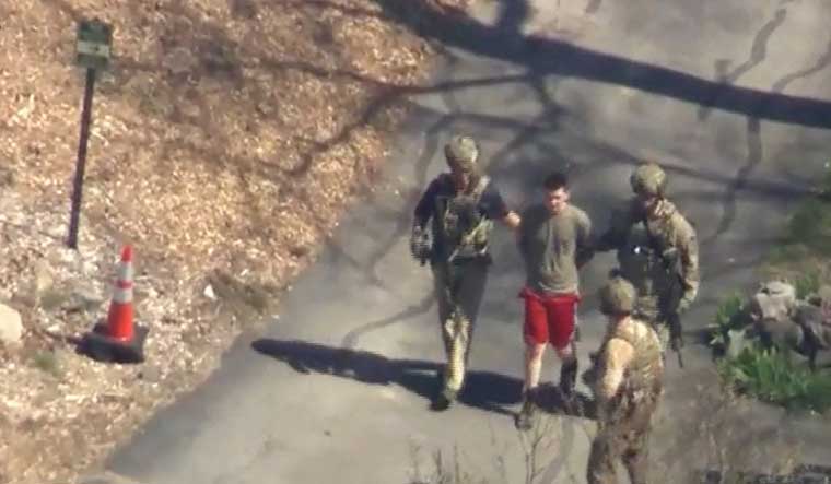 FBI agents arrest Jack Teixeira, an employee of the U.S. Air Force National Guard, in connection with an investigation into the leaks online of classified U.S. documents | Reuters