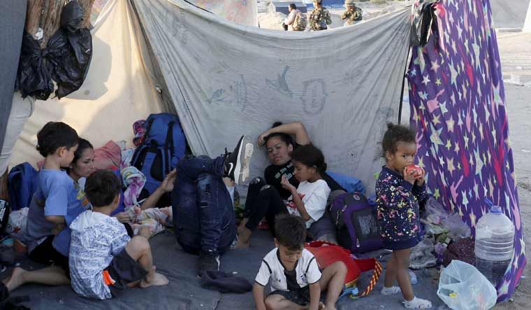 Undocumented migrants mostly from Venezuela, Colombia and Haiti stay at a makeshift tent at the Chilean and Peruvian border | Reuters