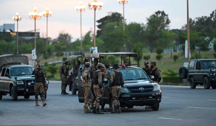 Army troops stand guard in the "red zone" after the arrest of Pakistan's former prime minister Imran Khan triggered violent protests by his supporters in Islamabad | AFP