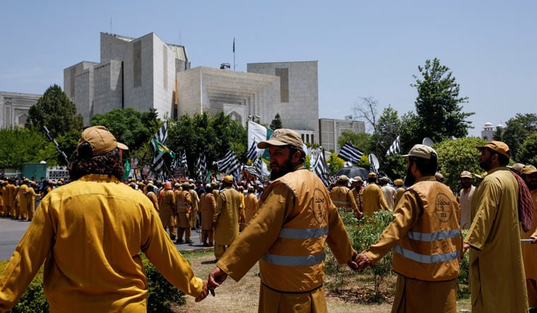 Supporters of Pakistan Democratic Movement (PDM), a coalition of political parties, gather in front of the Supreme Court of Pakistan to protest against the granting of bail in several cases to Pakistan's former Prime Minister Imran Khan, in Islamabad, Pakistan May 15, 2023 | Reuters