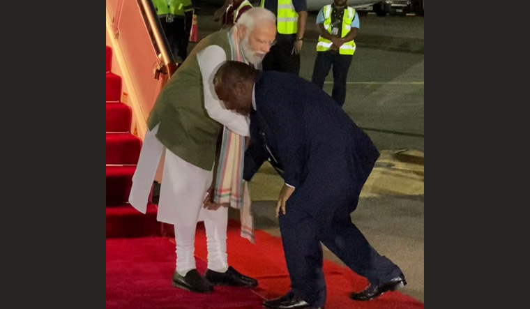Prime Minister of Papua New Guinea James Marape touches Prime Minister Narendra Modi's feet | PTI