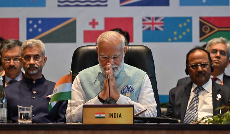 Prime Minister Narendra Modi prays at the start of the Forum for India Pacific Islands Cooperation at Port Moresby in Papua New Guinea | AFP 