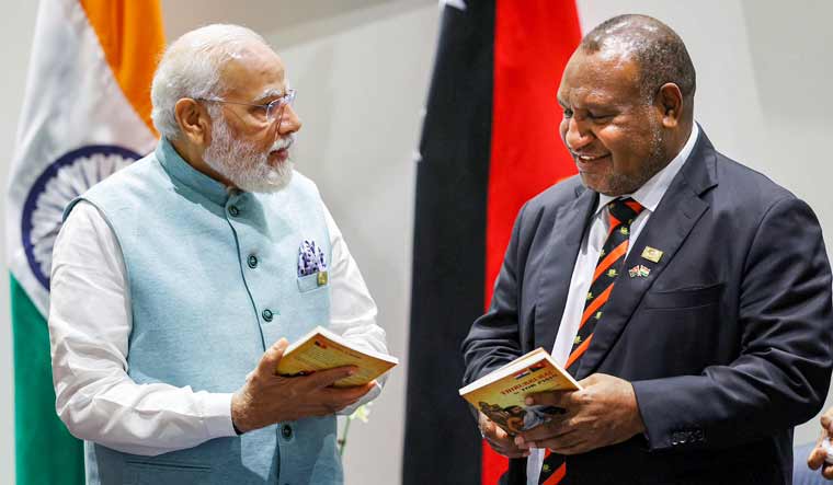 Prime Minister Narendra Modi with Papua New Guinea PM James Marape launches a translation of the Tamil classic Thirukkural in the Tok Pisin language of Papua New Guinea, in Port Moresby | PTI