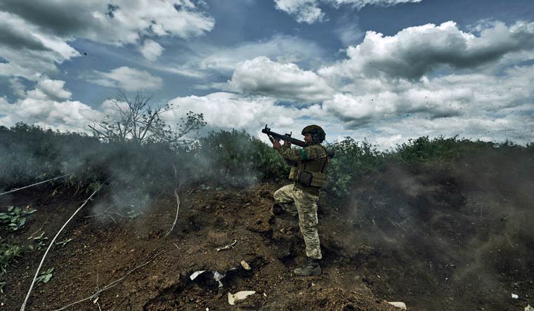 A Ukrainian soldier fires an RPG toward Russian positions at the frontline near Bakhmut in the Donetsk region, Ukraine, Monday, May 22, 2023 | AP