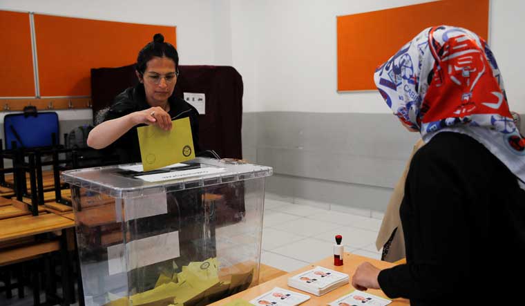 A person votes during the second round of the presidential election, in Istanbul, Turkey May