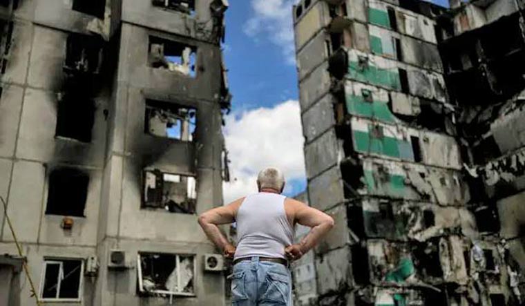 One of the images that won the AP a Pulitzer prize. A man looks at buildings destroyed during Russian attacks on Borodyanka on the outskirts of Kyiv. Photograph: Natacha Pisarenko | AP