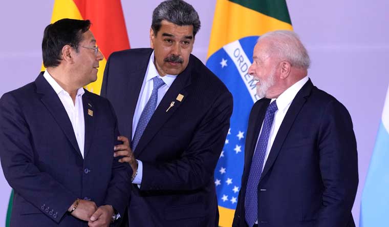 Bolivia's president Luis Arce, from left, Venezuela's president Nicolas Maduro and Brazilian president Luiz Inacio Lula da Silva assemble for a group photo during the South American Summit at Itamaraty palace in Brasilia, Brazil | AP 
