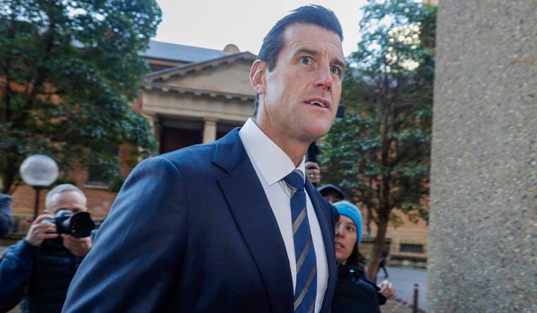 FILE - Ben Roberts-Smith arrives at the Federal Court in Sydney, on June 9, 2021. Australia’s most decorated living war veteran, Victoria Cross recipient Ben Roberts-Smith, committed a slew of war crimes while in Afghanistan including the unlawful killings of unarmed prisoners, a judge ruled on Thursday, June 1, 2023. (AP Photo/Rick Rycroft, File)