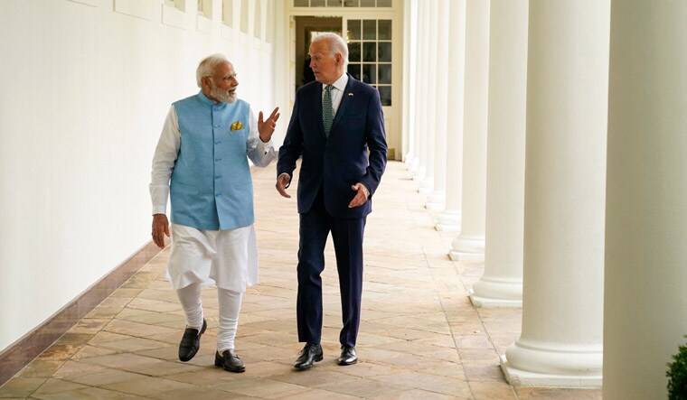 US President Joe Biden and India's Prime Minister Narendra Modi walk through the Colonnade to the Oval Office of the White House in Washington, DC, on June 22, 2023. (Photo by Evan Vucci / POOL / AFP)