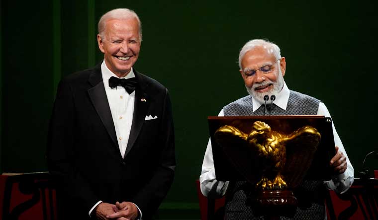India's Prime Minister Narendra Modi speaks next to U.S. President Joe Biden during an official state dinner at the White House in Washington | Reuters