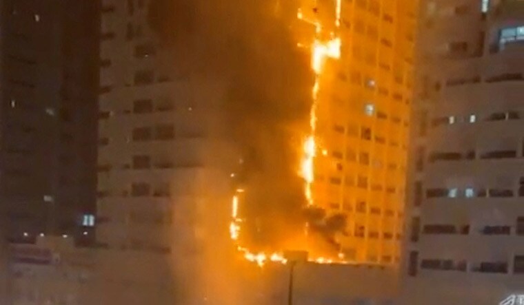 Emergency services personnel work to control a fire at a residential building in Ajman, United Arab Emirates, June 27, 2023  | Reuters