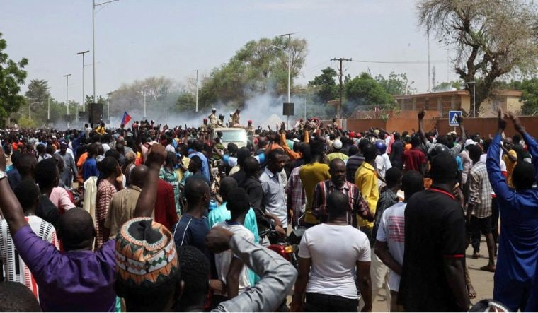 Nigerien security forces launch tear gas to disperse pro-junta demonstrators gathered outside the French embassy, in Niamey, the capital city of Niger July 30, 2023 | Reuters