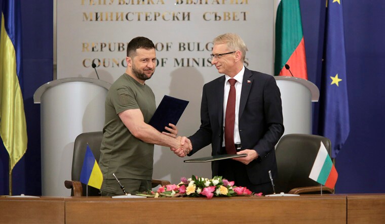 Ukrainian President Volodymyr Zelenskyy shakes hands with Bulgaria's Prime Minister Nikolay Denkov, after signing a memorandum,  at the Council of Ministers office in Sofia, Bulgaria, Thursday, July 6, 2023. Zelenskyy is in Bulgaria on a one day official visit. (AP Photo/Valentina Petrova)