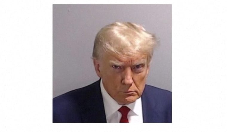 A post by former U.S. President Donald Trump of his police booking mugshot | Reuters